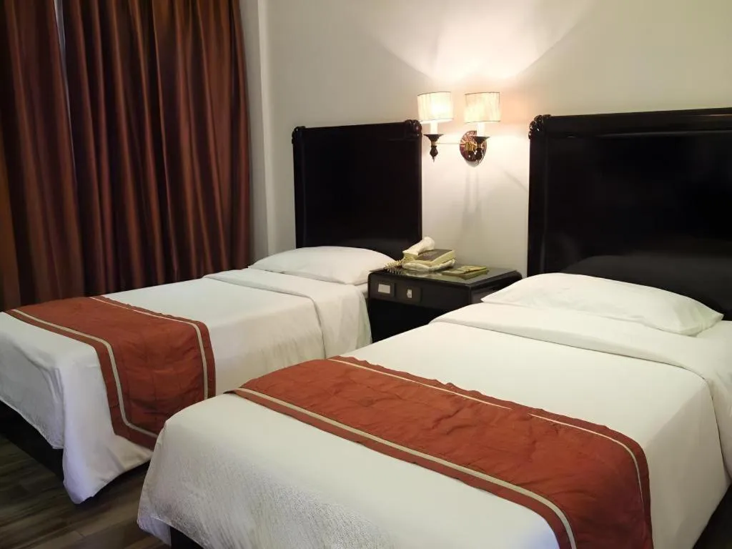 Bed in Alicia Hotel & Restaurant