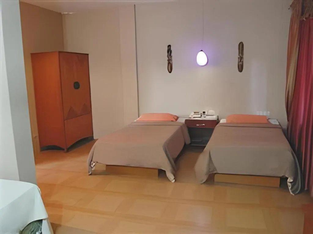 Bed in Alicia Hotel & Restaurant