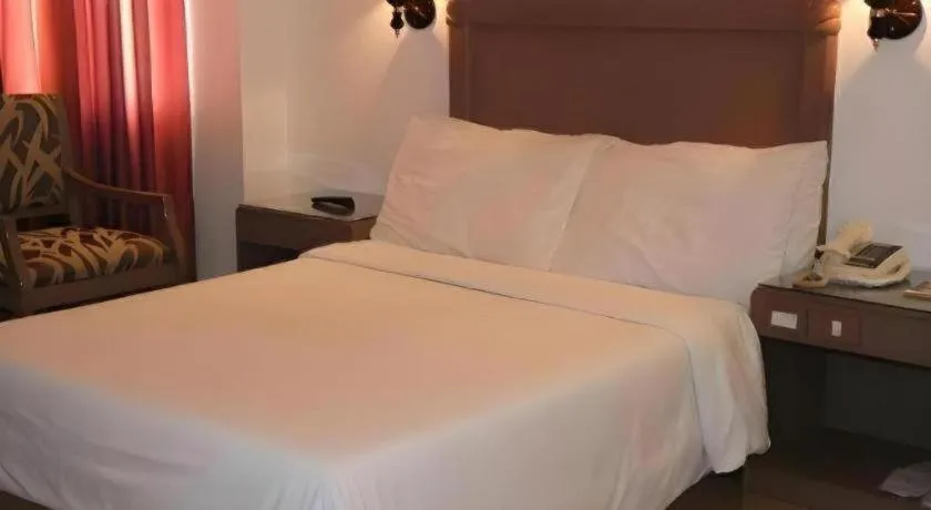 Bed in Alicia Hotel & Restaurant