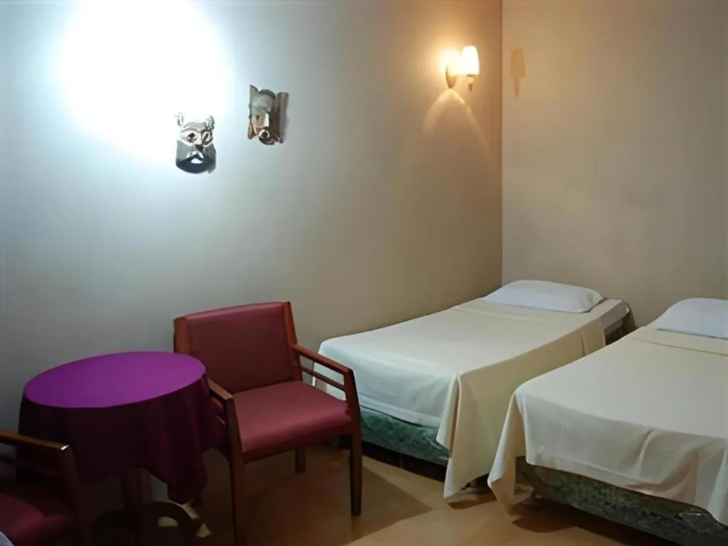 Bed in Alicia Hotel & Restaurant