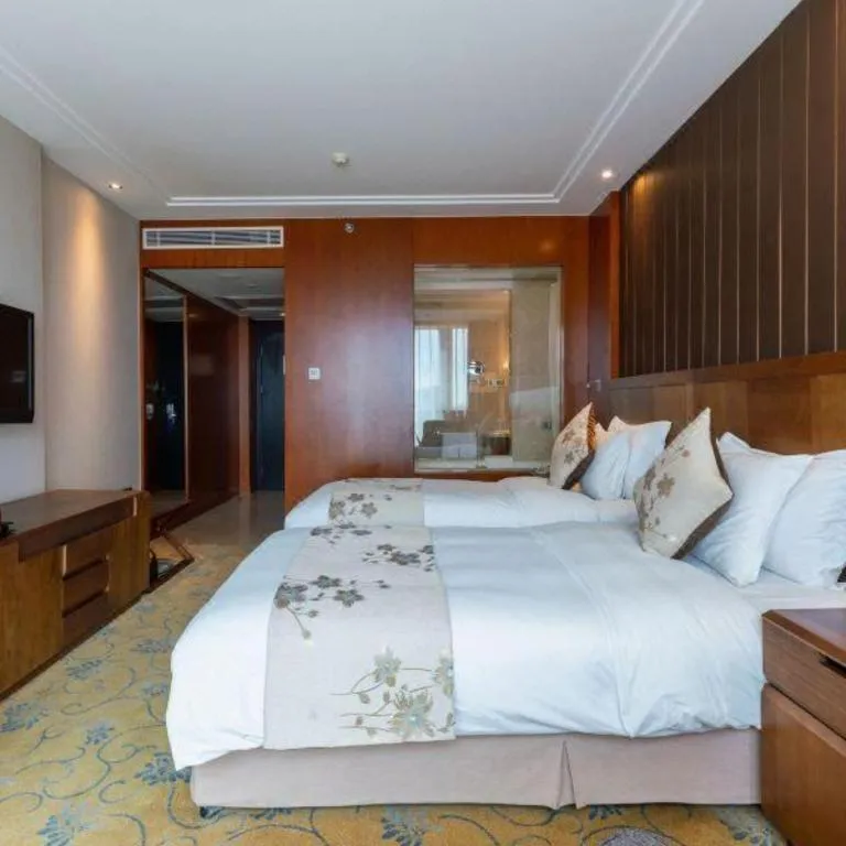 Bed in Qingdao Haidu Hotel