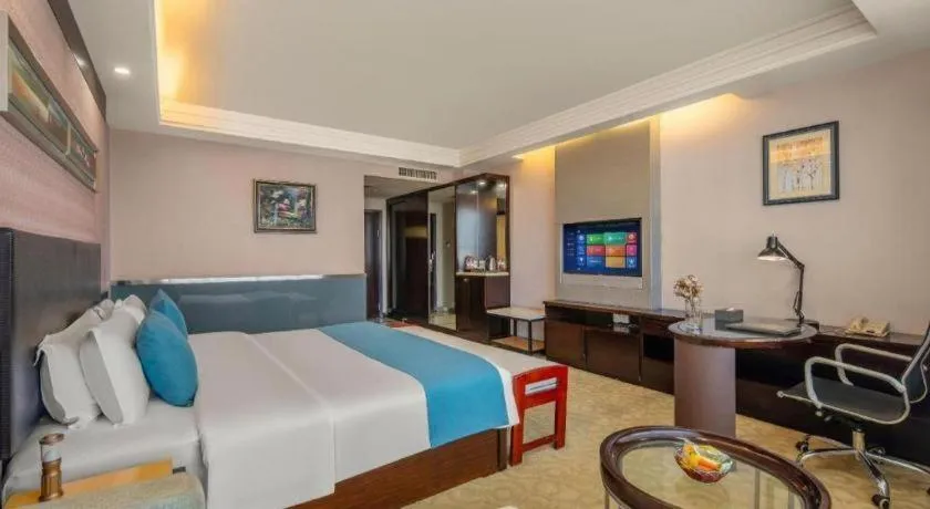 Bed in Aksu Pudong Holiday Hotel