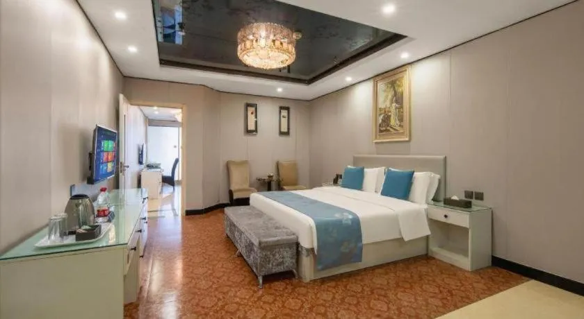 Bed in Aksu Pudong Holiday Hotel