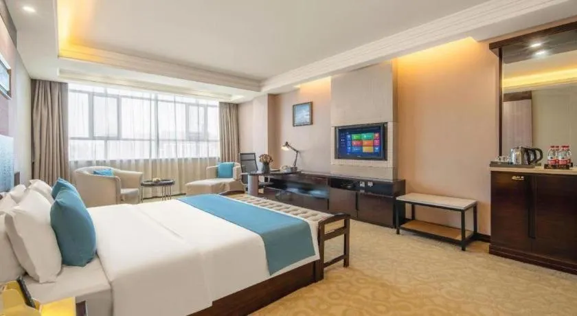 Bed in Aksu Pudong Holiday Hotel