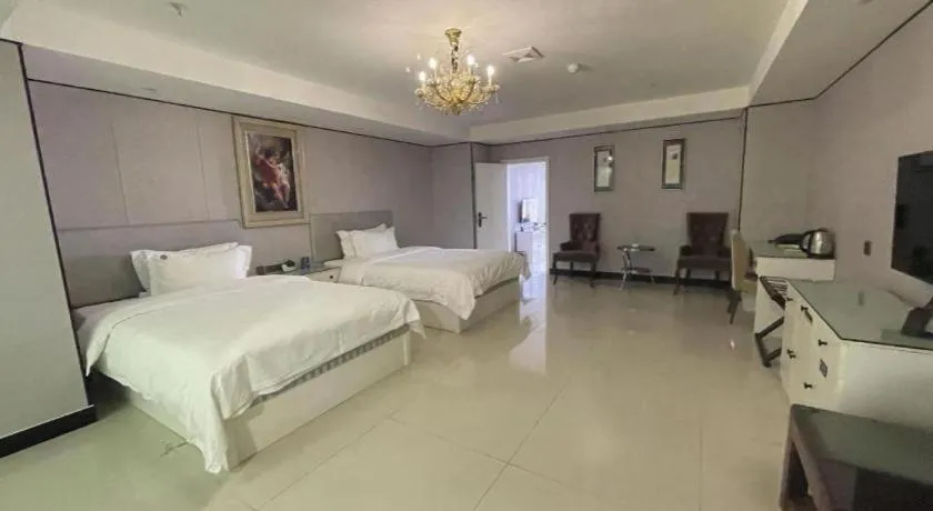 Bed in Aksu Pudong Holiday Hotel