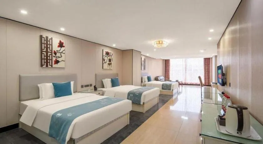 Bed in Aksu Pudong Holiday Hotel