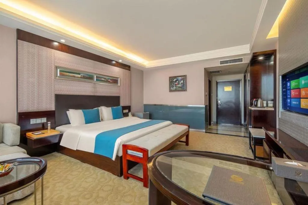 Bed in Aksu Pudong Holiday Hotel