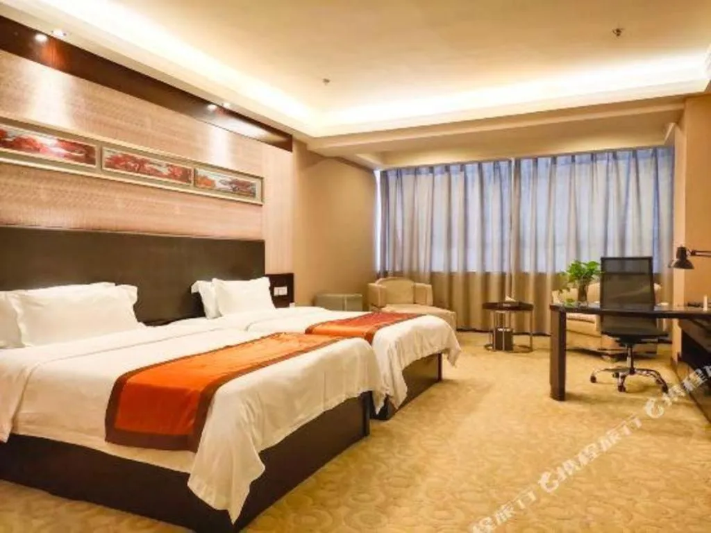 Bed in Aksu Pudong Holiday Hotel