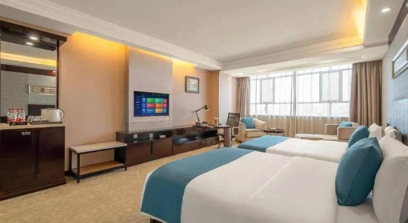 Bed in Aksu Pudong Holiday Hotel