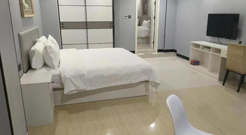 Bed in Aksu Pudong Holiday Hotel