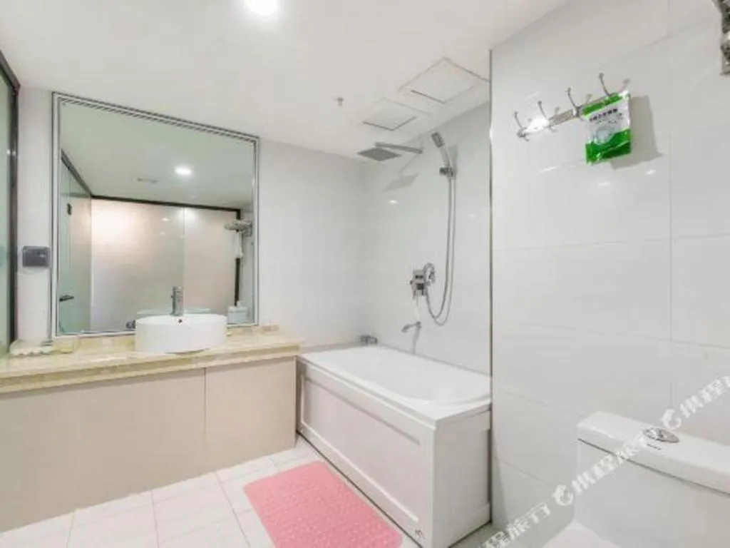 Bed in Aksu Pudong Holiday Hotel