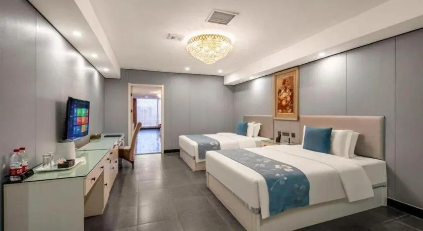 Bed in Aksu Pudong Holiday Hotel