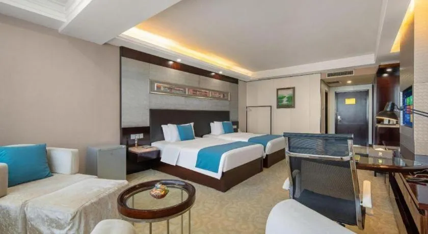 Bed in Aksu Pudong Holiday Hotel