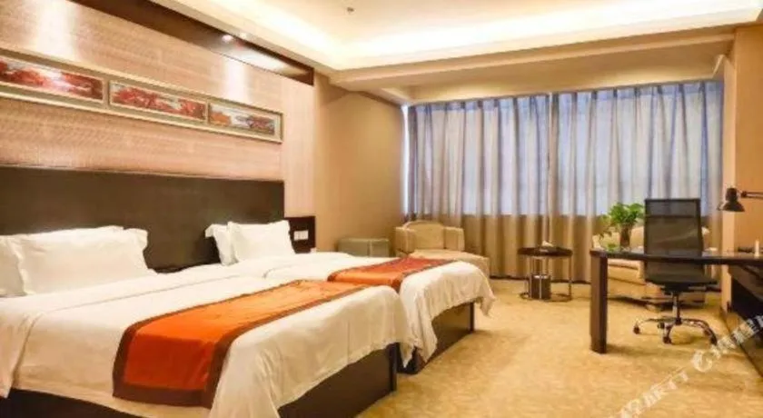 Bed in Aksu Pudong Holiday Hotel