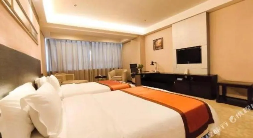 Bed in Aksu Pudong Holiday Hotel