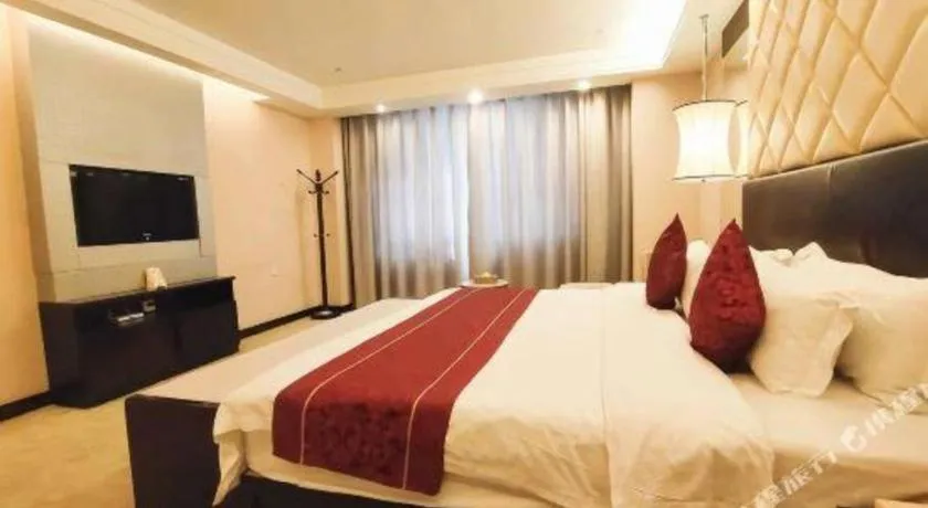 Bed in Aksu Pudong Holiday Hotel