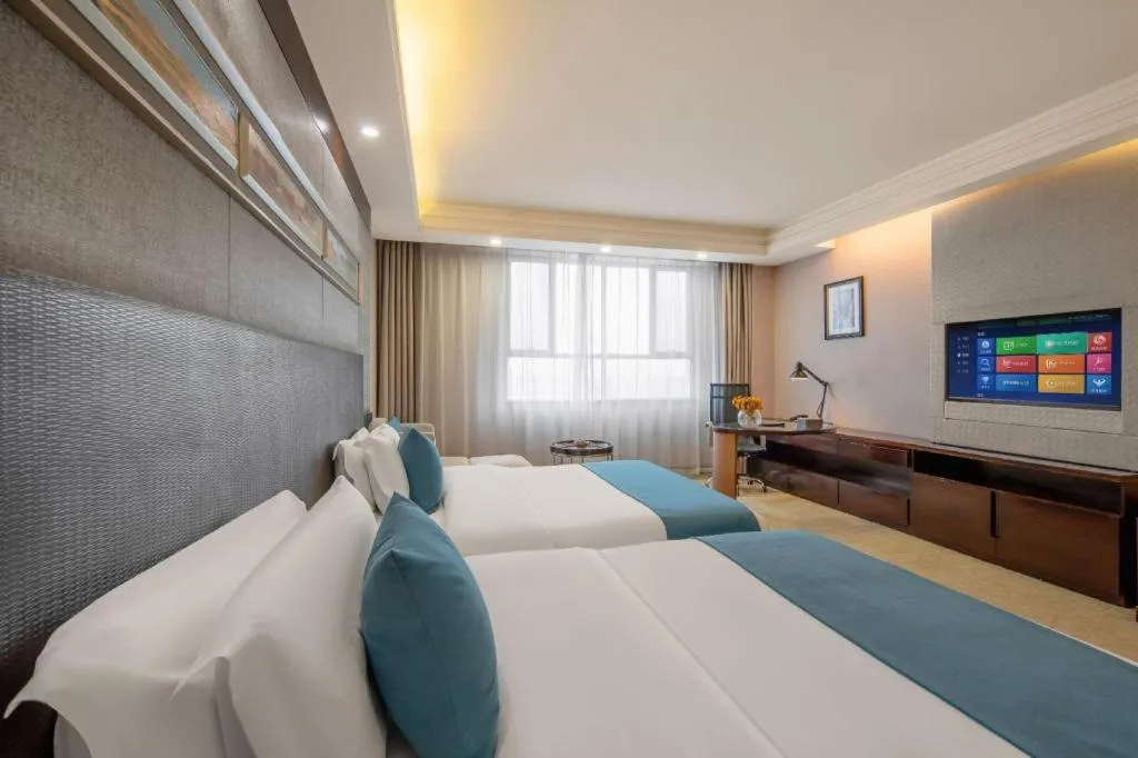 Bed in Aksu Pudong Holiday Hotel