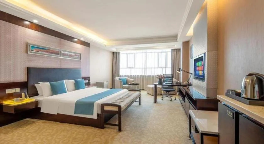 Bed in Aksu Pudong Holiday Hotel