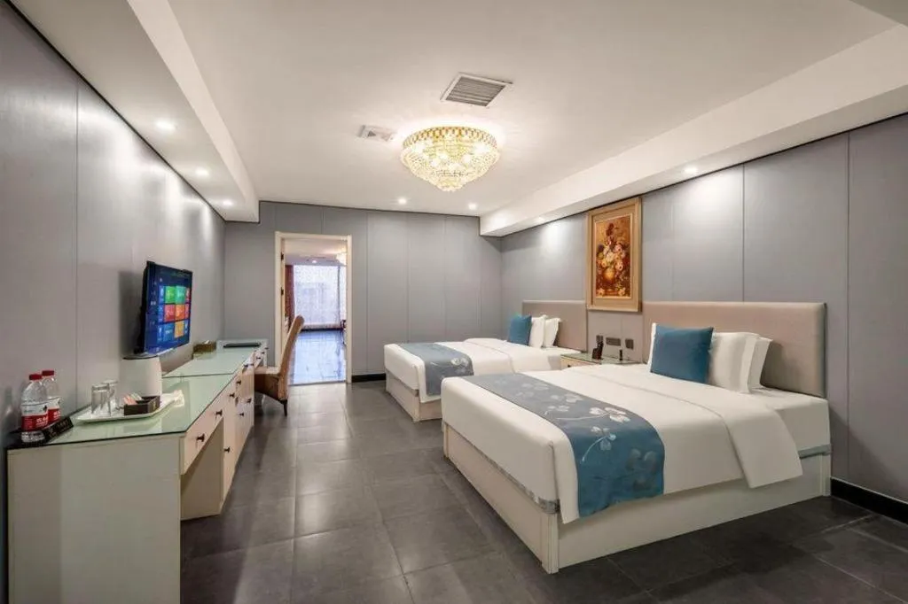 Bed in Aksu Pudong Holiday Hotel