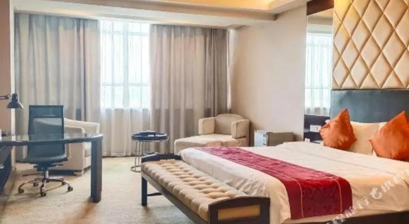 Bed in Aksu Pudong Holiday Hotel