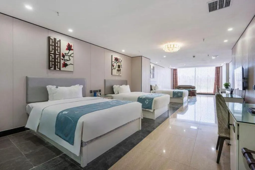 Bed in Aksu Pudong Holiday Hotel