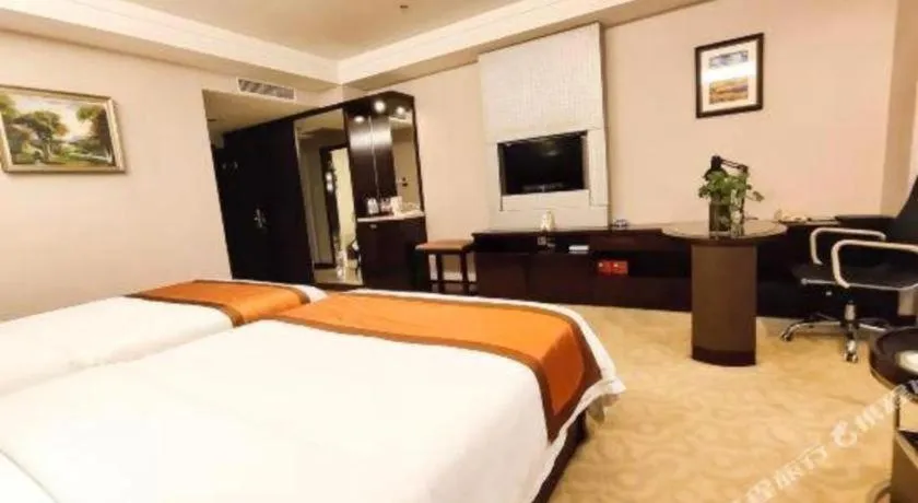 Bed in Aksu Pudong Holiday Hotel