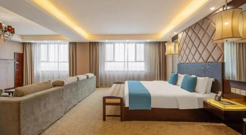 Bed in Aksu Pudong Holiday Hotel