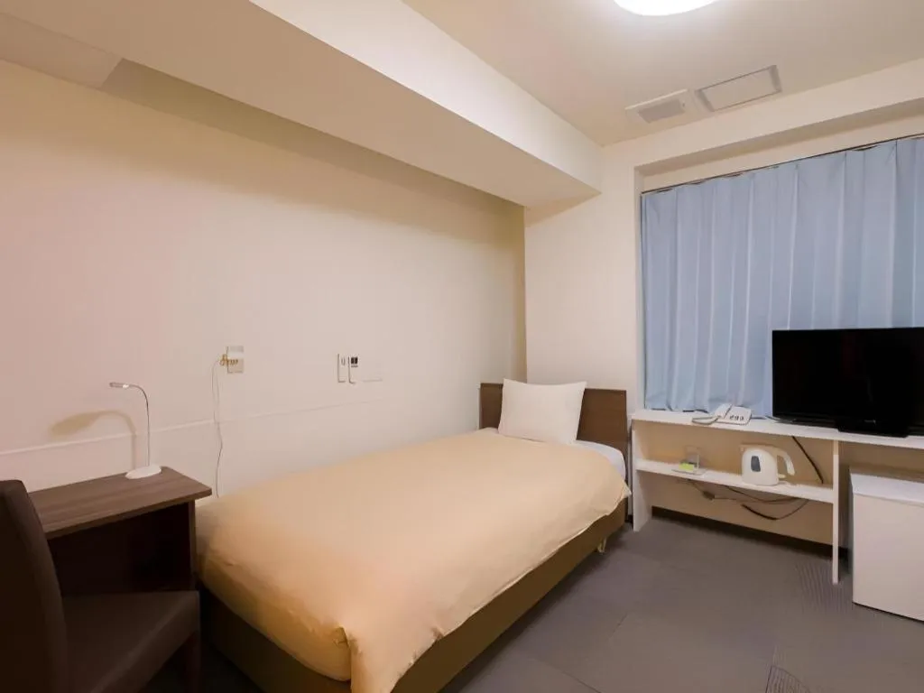 Bed in Ikebukuro Royal Hotel Higashiguchi