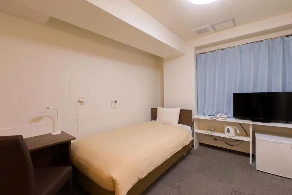 Bed in Ikebukuro Royal Hotel Higashiguchi