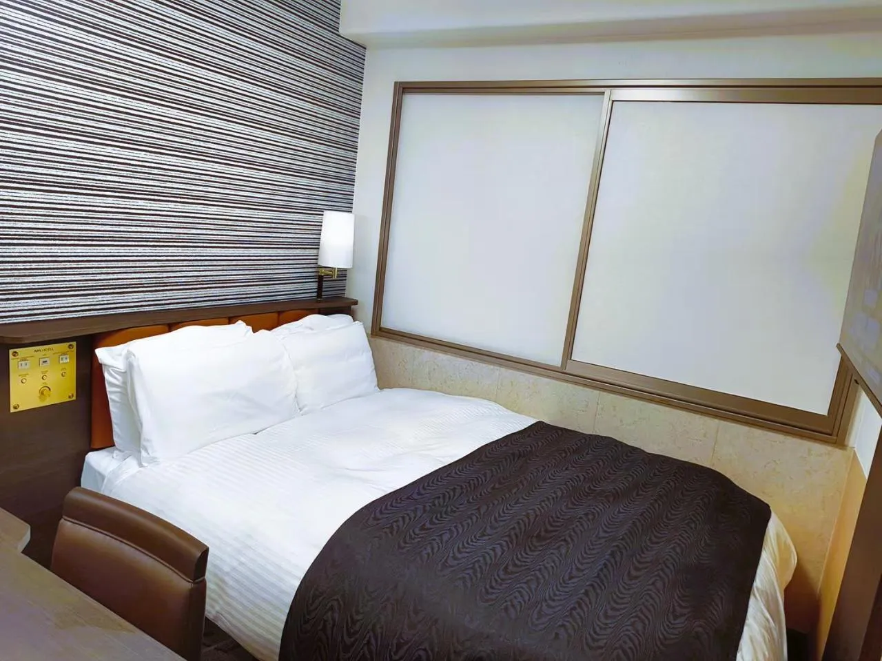 Bed in APA Hotel Tokushima Ekimae