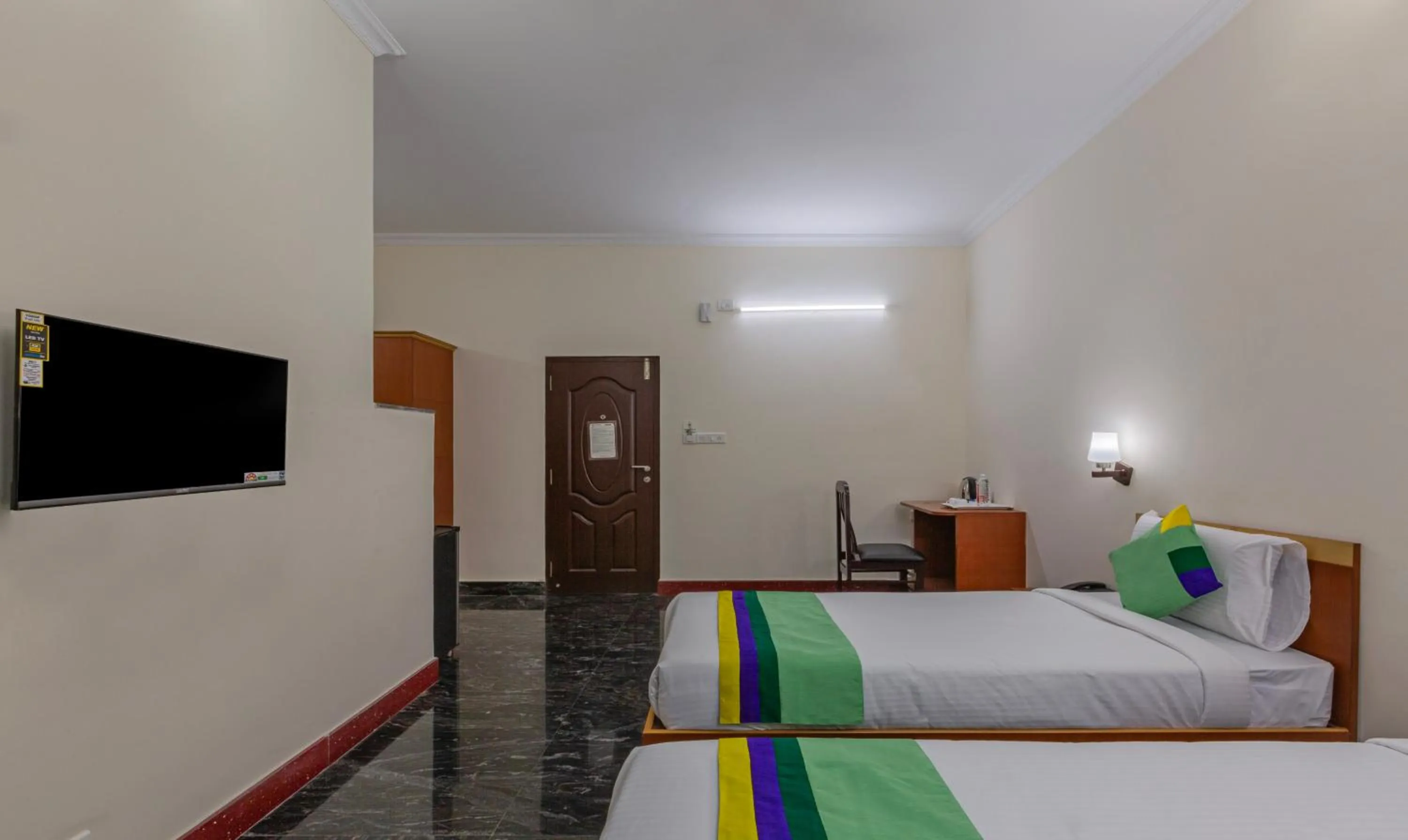 Bed in Treebo Akshaya Residency