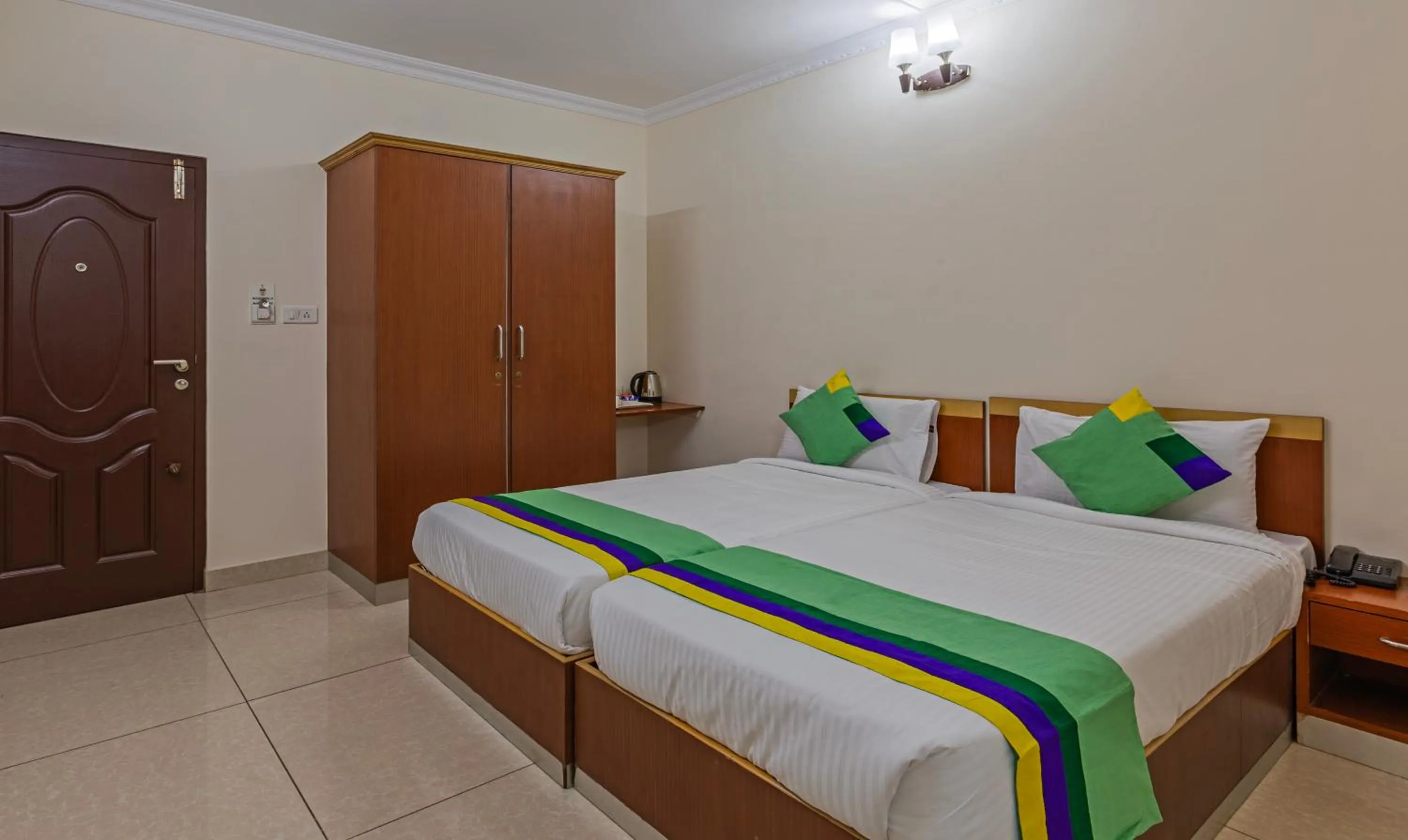 Bed in Treebo Akshaya Residency