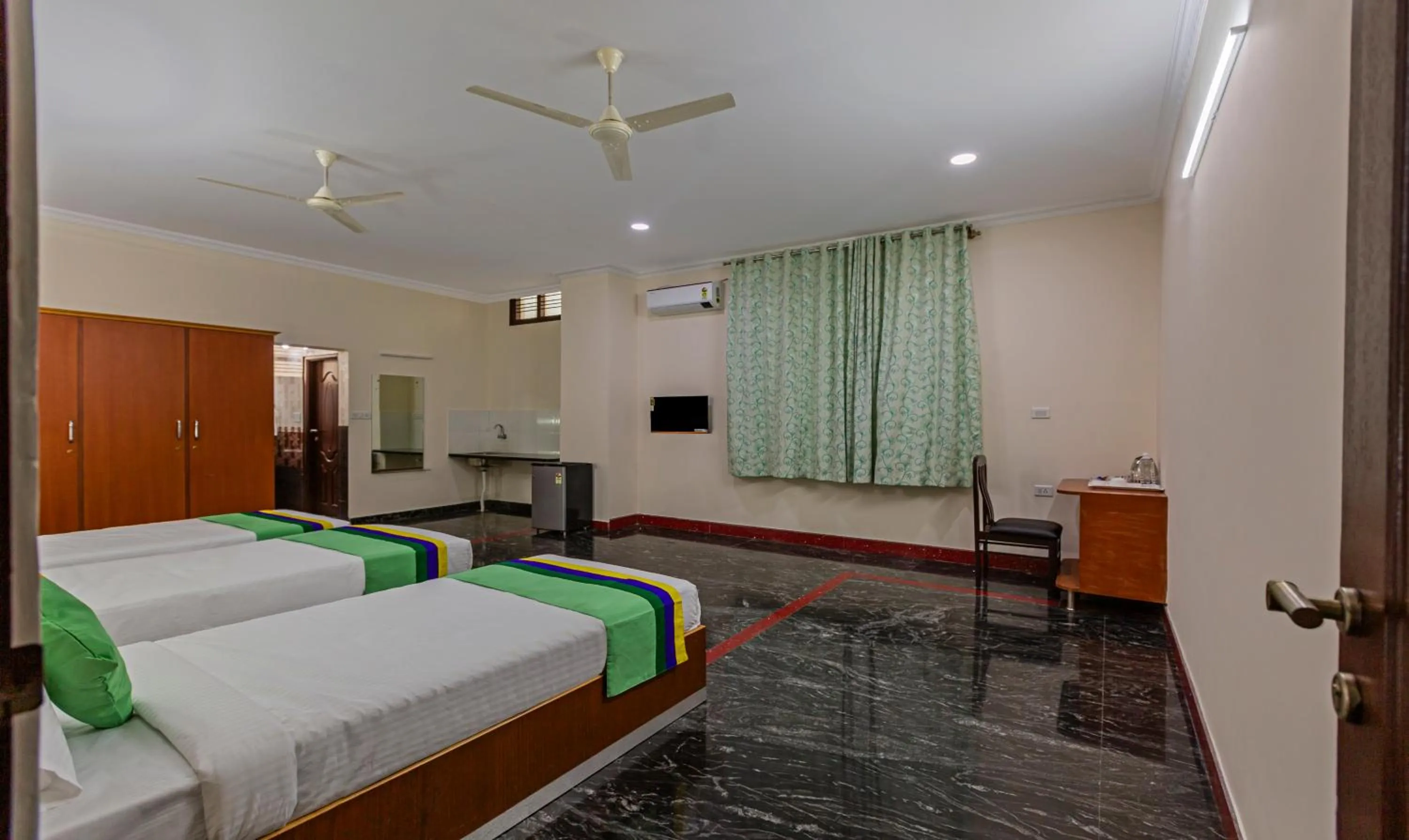 Bed in Treebo Akshaya Residency