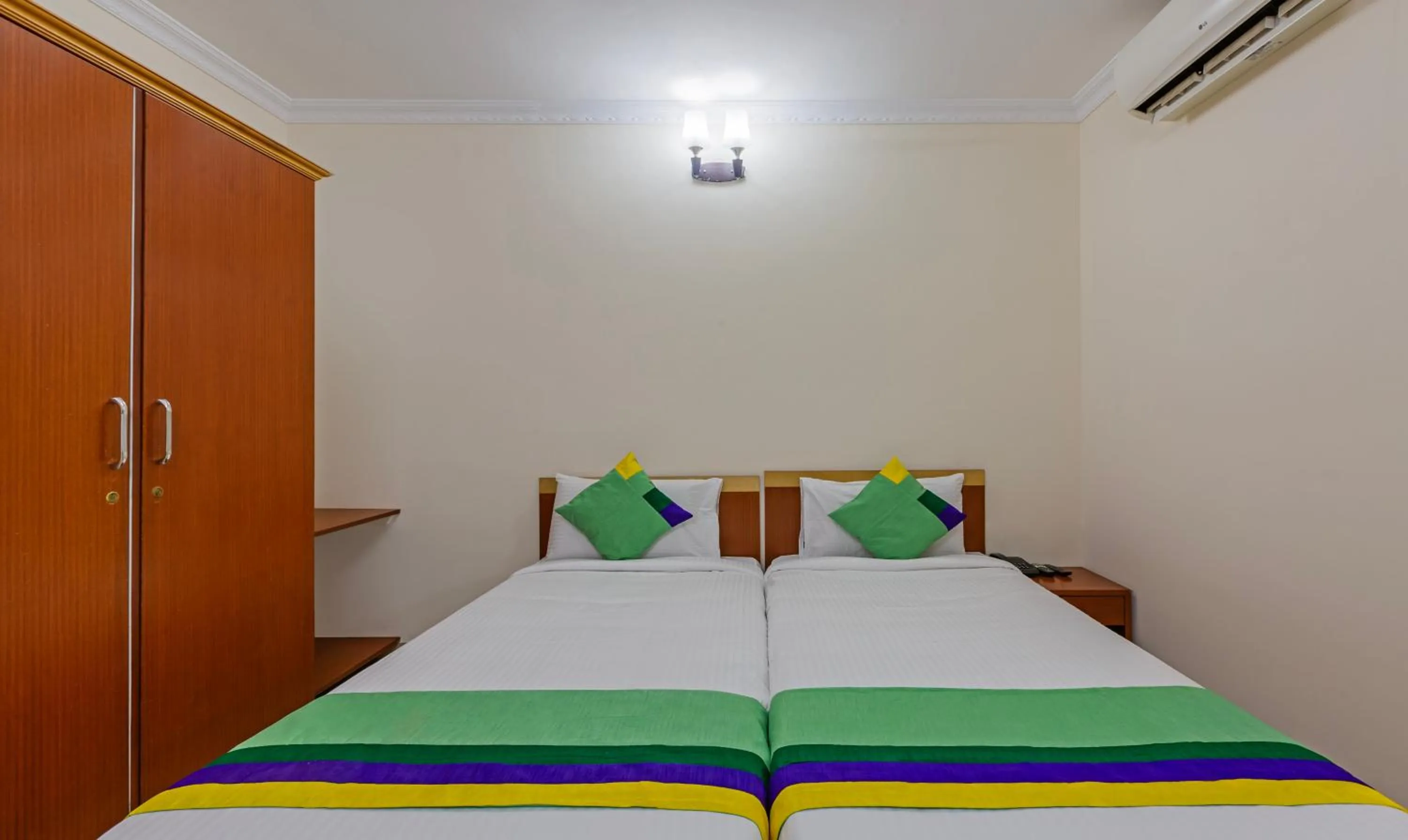 Bed in Treebo Akshaya Residency