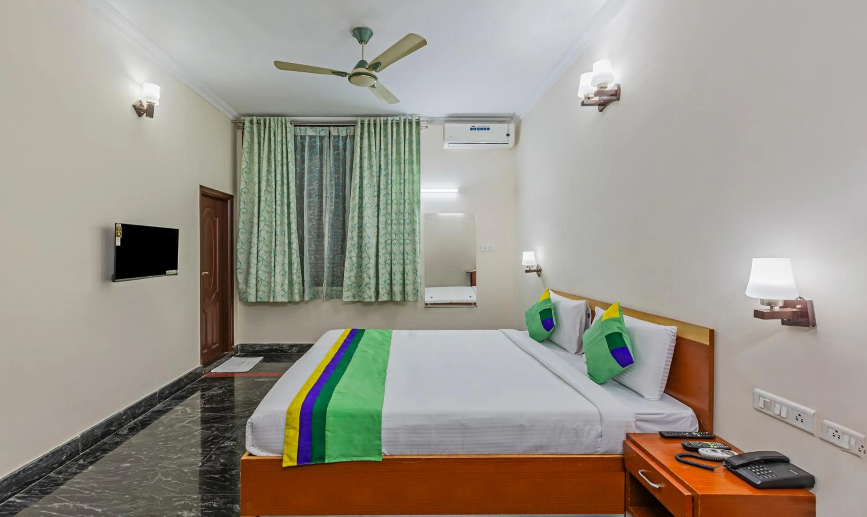Bed in Treebo Akshaya Residency