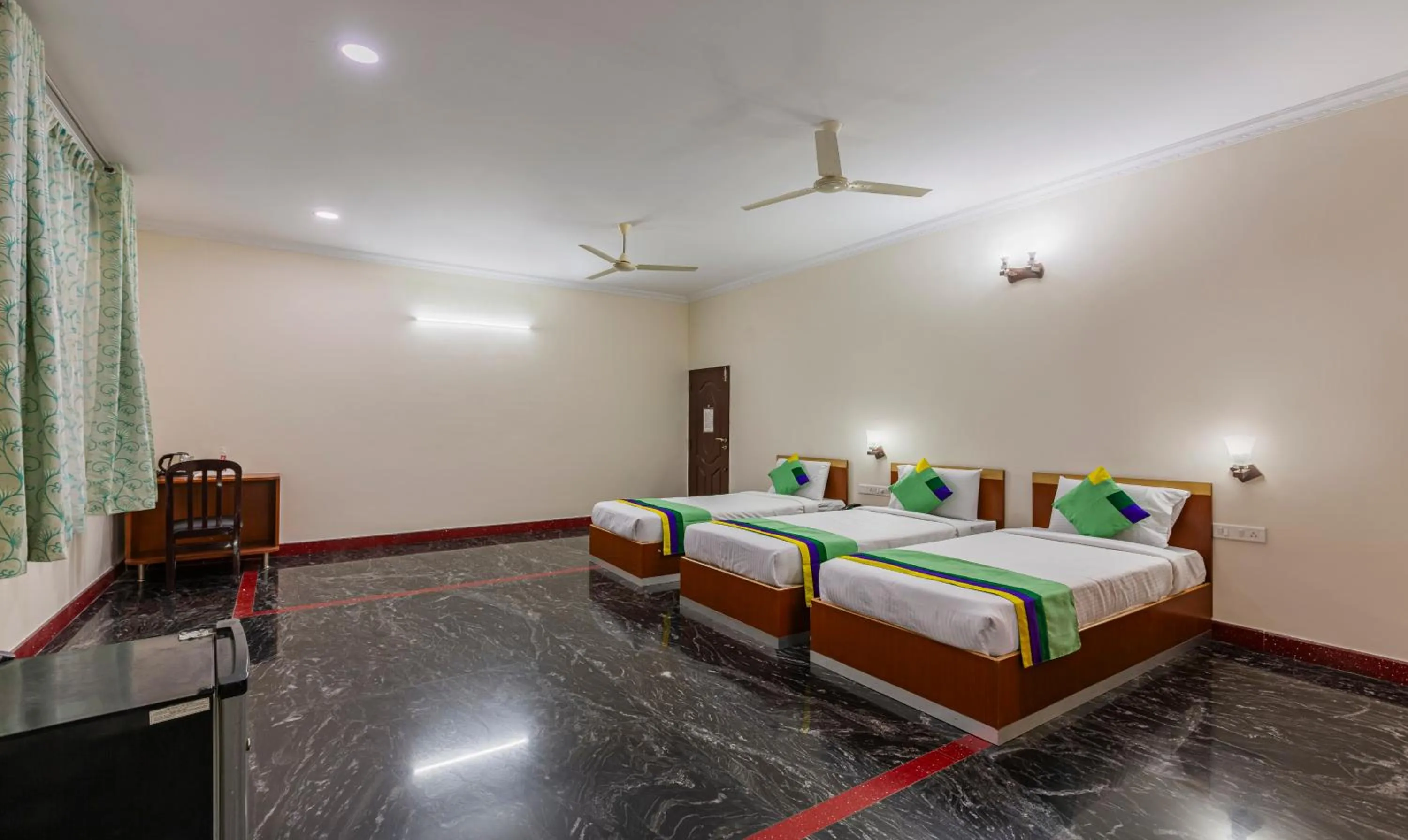 Bed in Treebo Akshaya Residency