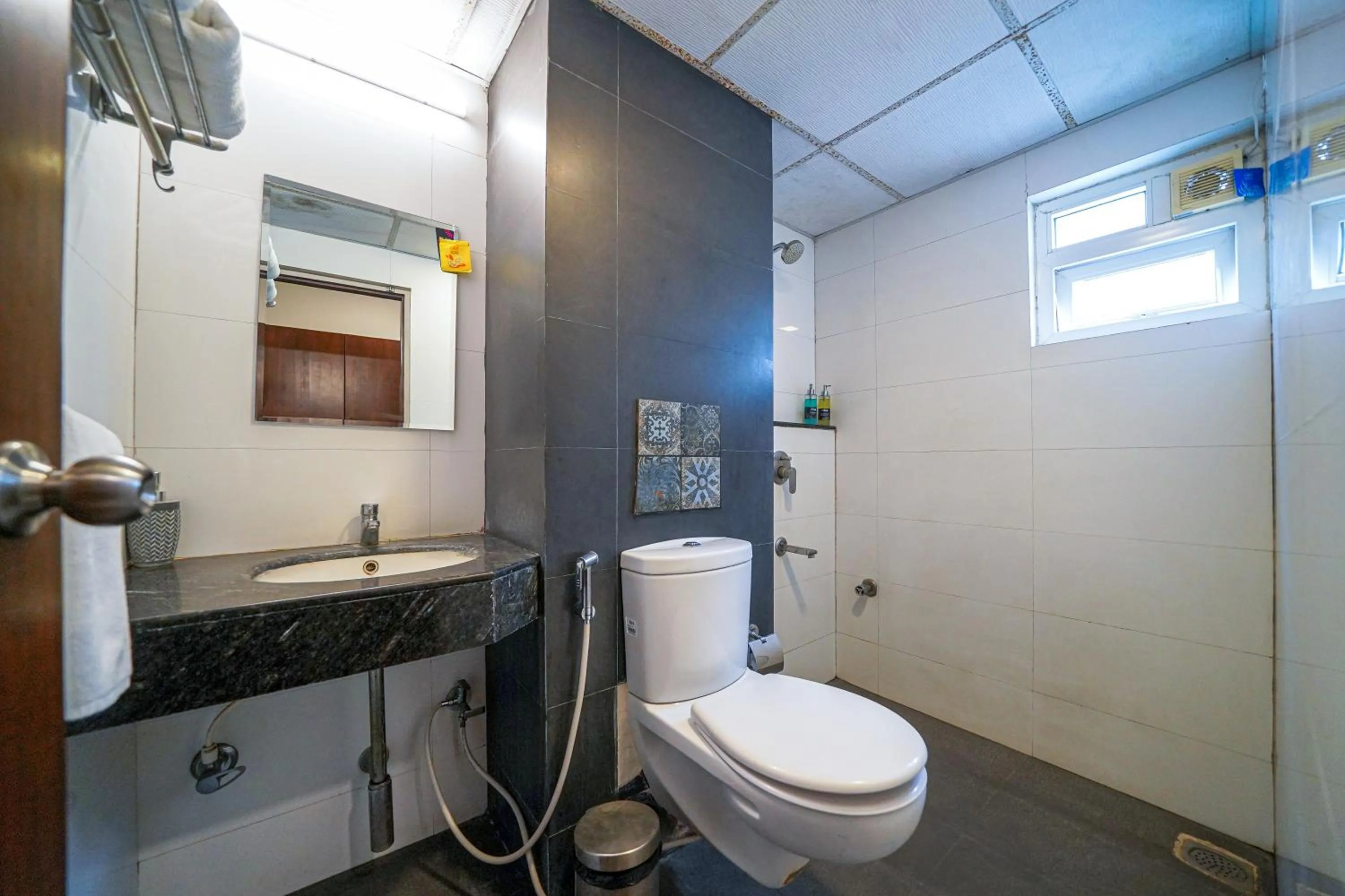 Shower in Olive Hotel Electronic City by Embassy Group