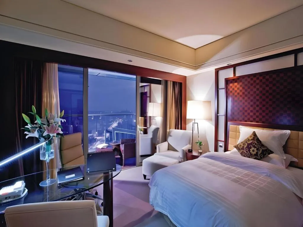 Bed in Shangyu International Hotel