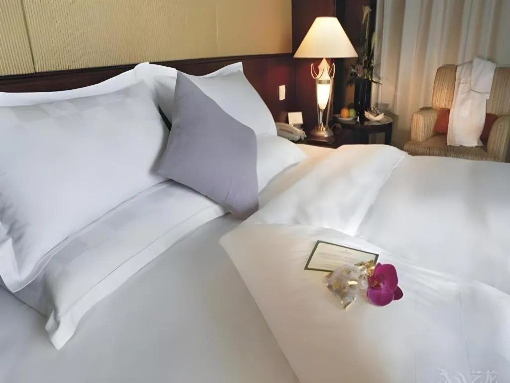 Bed in Shangyu International Hotel