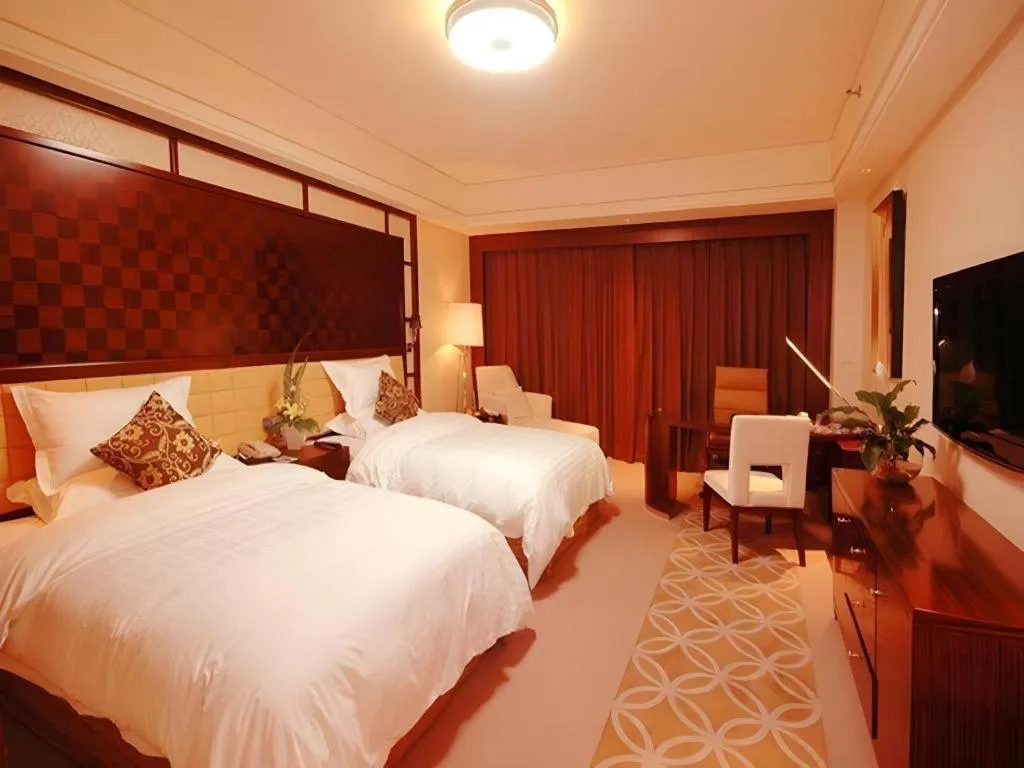 Bed in Shangyu International Hotel