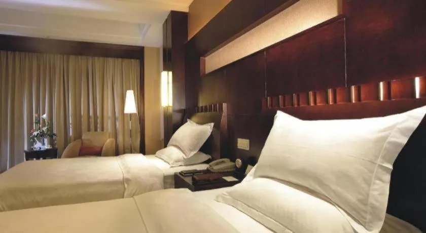 Bed in Shangyu International Hotel