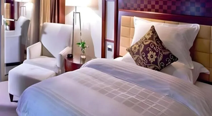 Bed in Shangyu International Hotel