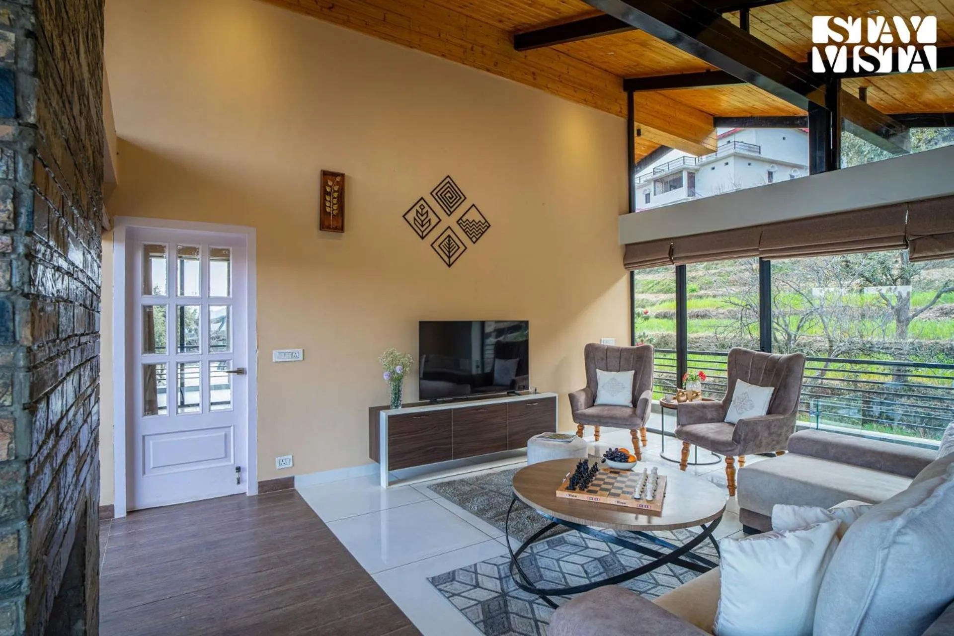 Living room in StayVista at Mountain Melody with Heater & Indoor-Outdoor Games