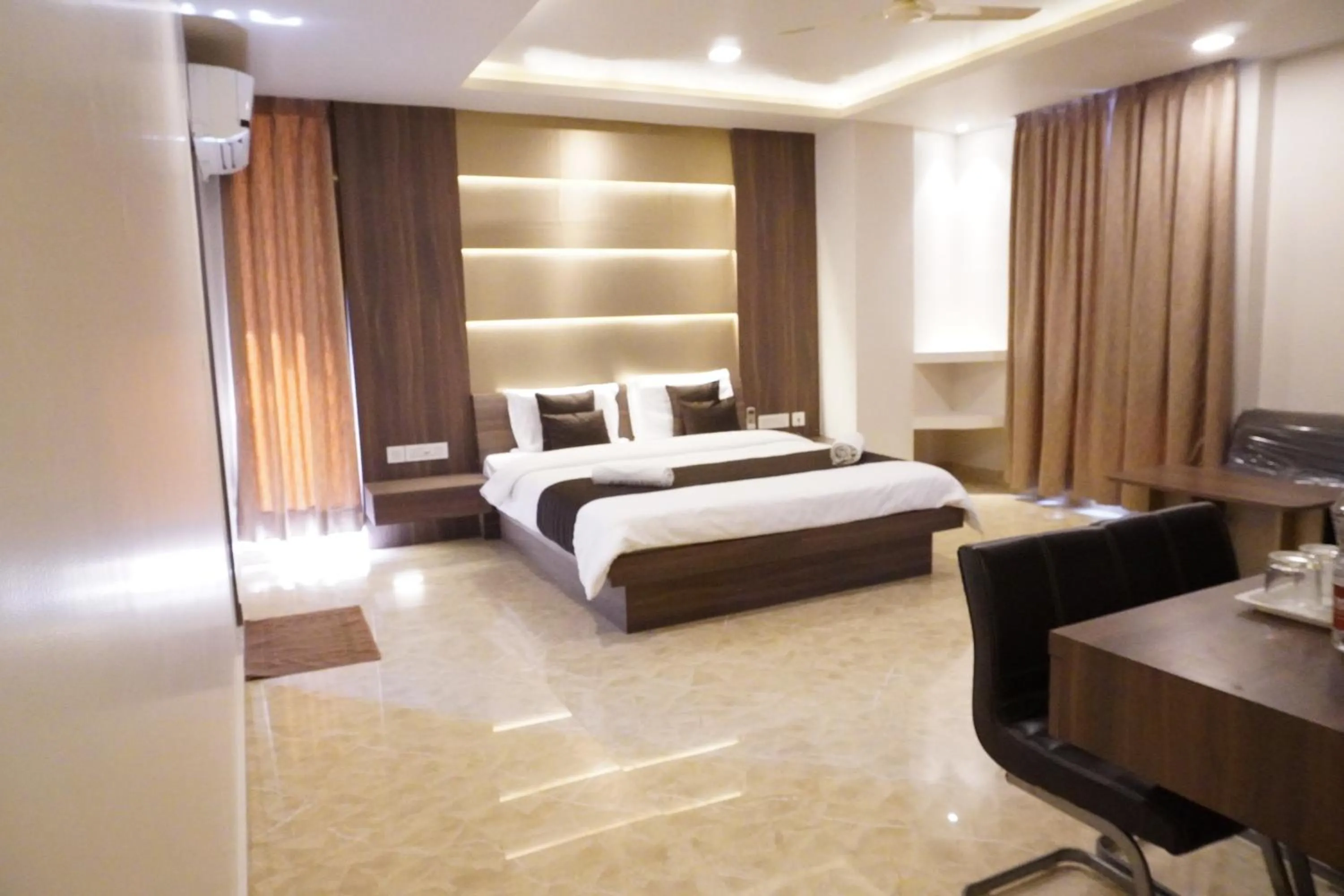 Photo of the whole room, Bed in HSM Grand Inn, Chittoor