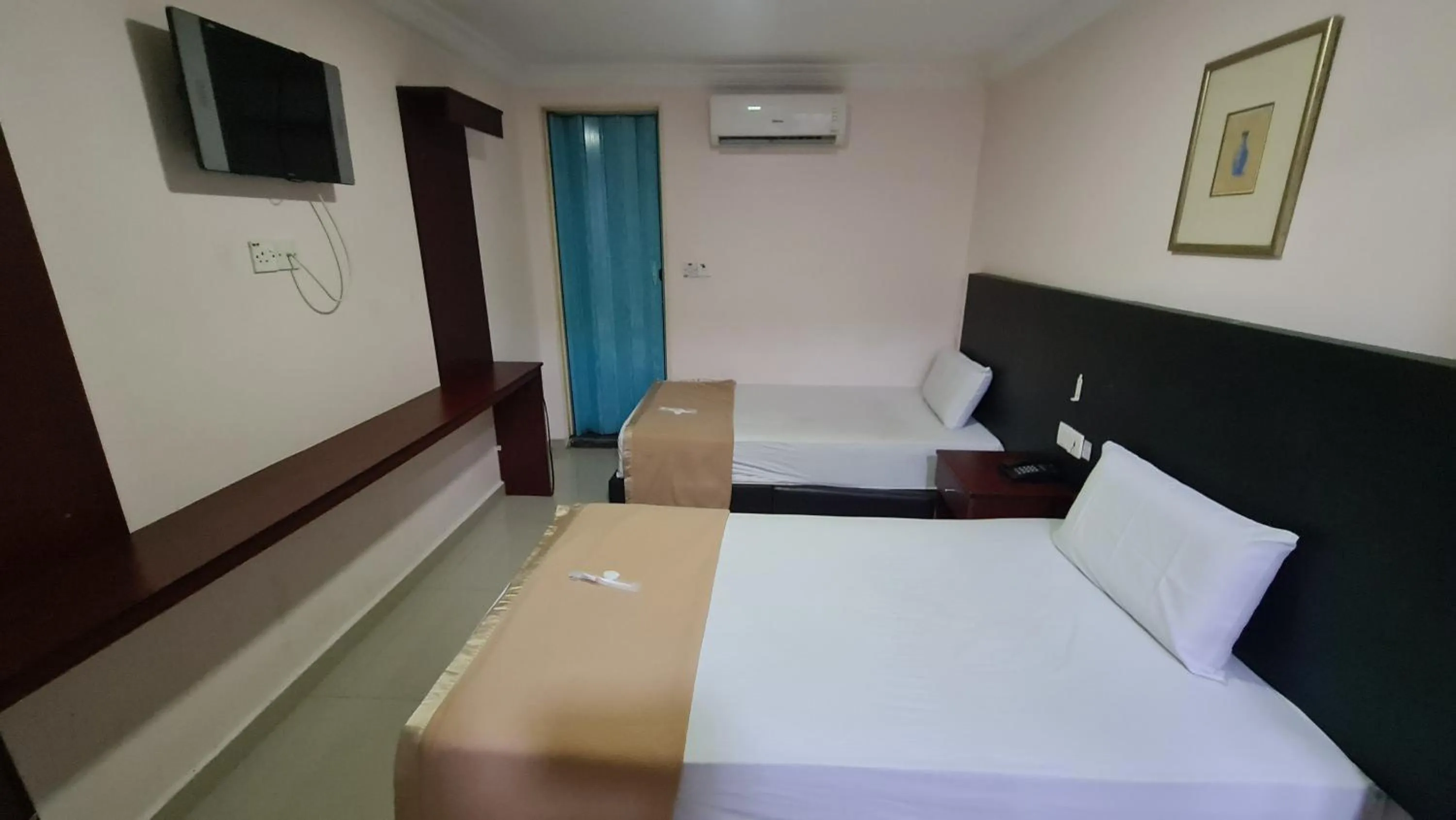 Bed in SP Venture Boutique Hotel