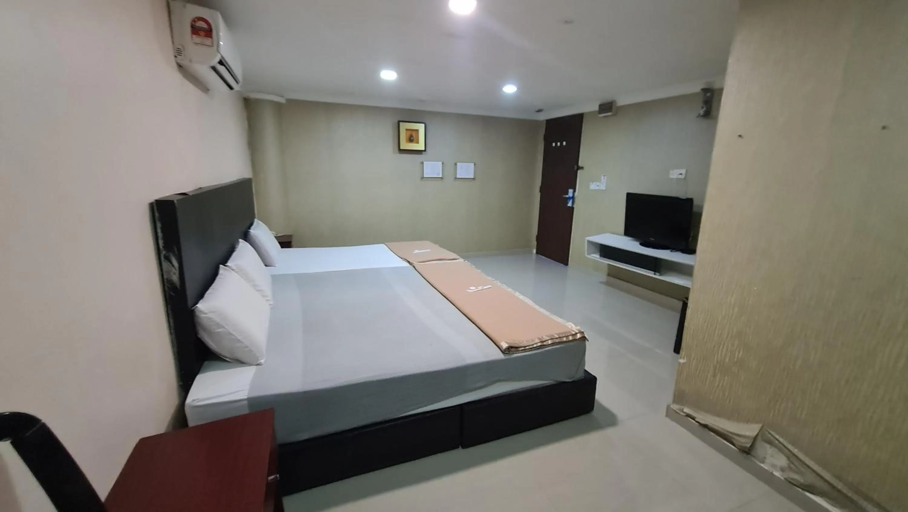 Bed in SP Venture Boutique Hotel