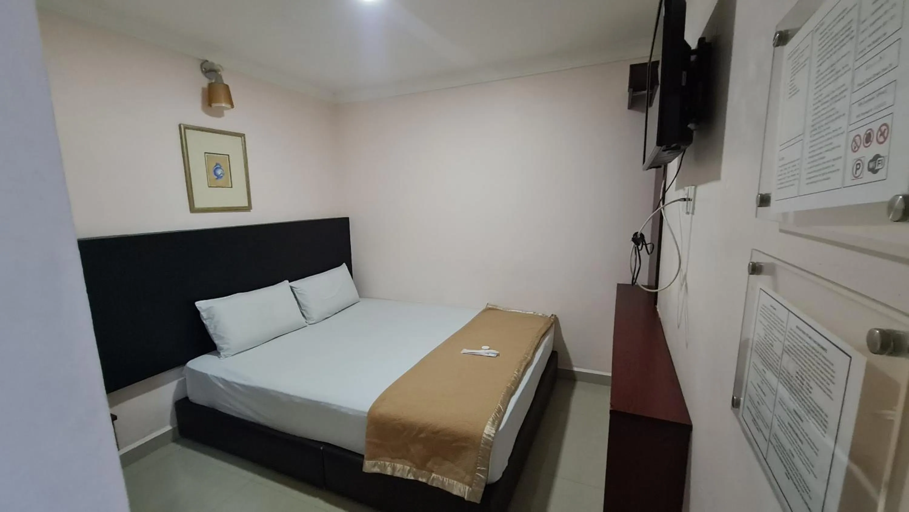 Bed in SP Venture Boutique Hotel