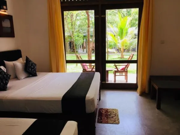 Bed in Nil Diya Mankada Safari Lodge