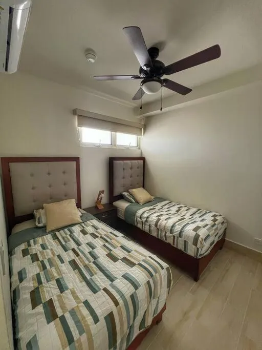 Bed in Playa Caracol Apartment