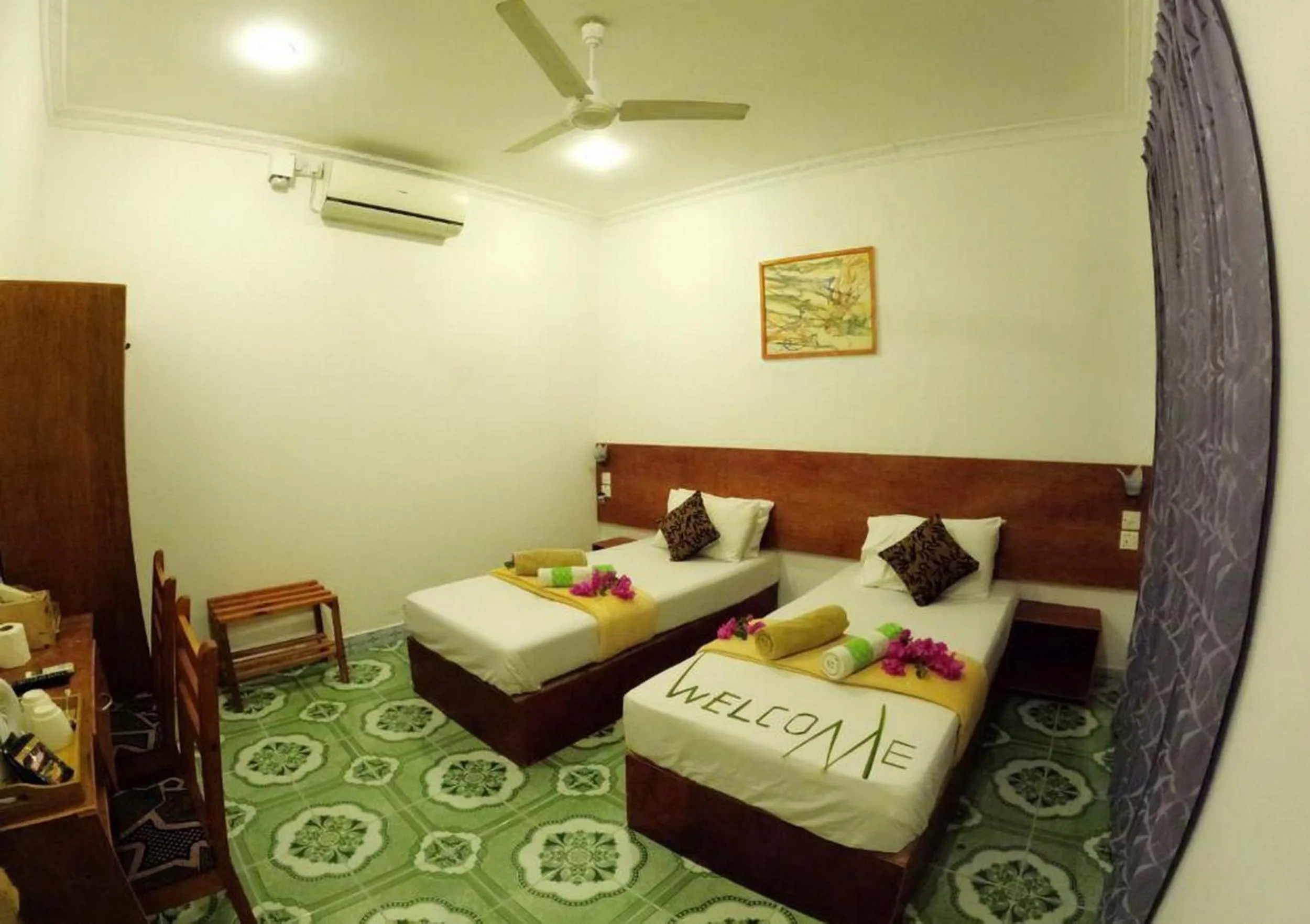 Bed in Adroit Beach Inn